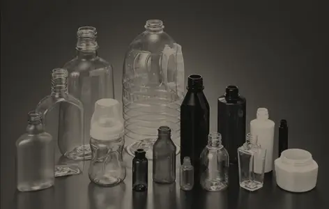 Blow-moulded bottles and containers of the kind produced by the process