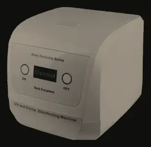 Compact banknote and coin sanitising machine