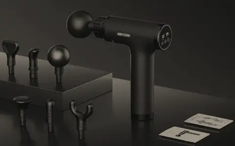 Percussive therapy device with interchangeable attachments